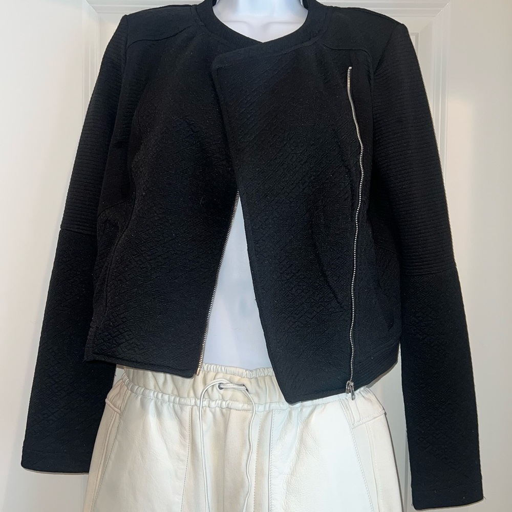 Beautiful women’s jacket with frontal zipper.